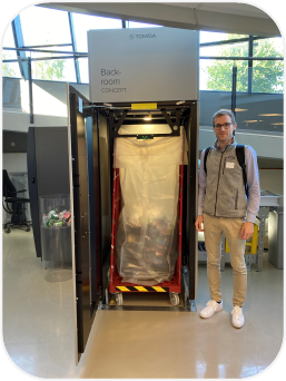 Fund manager Markus Gruber stands next to an installation for the return of returnable bottles from Tomra, a company from Norway.